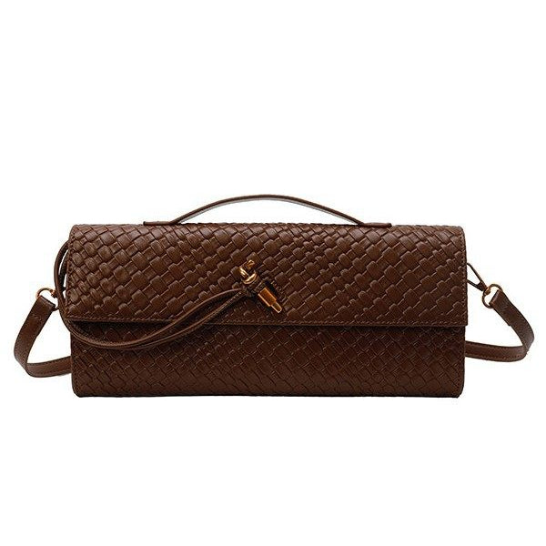Brown textured handbag with a strap on a white background